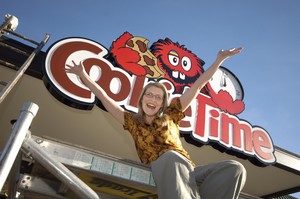 Cookie Time franchisee Verity Richard celebrates as the sign goes up on the new Queenstown store